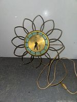 Front view showing full starburst frame and cord