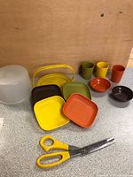 All pieces laid out: keeper, plates, tumblers, bowls, pie server