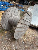 Side view showing full spool structure and weathered wood