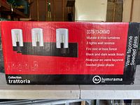 Box showing product details, brand, model, finish and glass type