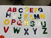 Magnetic letters laid out showing missing parts of D and I