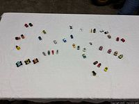 full layout of all miniature vehicles and boats on table