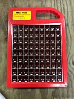 Front view of red Press ’N See keyboard showing full 9×9 multiplication grid and carry handle