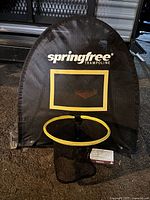 Front view of Springfree basketball net showing backboard, rim, and mesh net