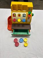 Front view of cash register with coins arranged in front