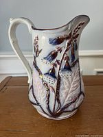 Front view of Dudson Bluebell copper lustre milk jug