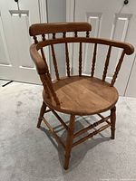 Front view of spindle-back pine captain's chair