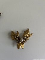 Front view showing leaf design and pearl cluster