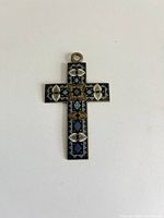 Front of cloisonné enamel cross pendant showing colour and design