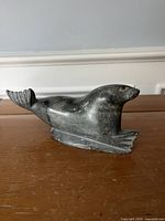 Side view of soapstone seal carving