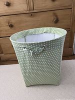 Full view of fabric bin showing color, pattern and handles