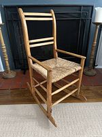 Full view of wooden ladder-back rocking chair