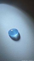 Top view of oval blue aquamarine cabochon