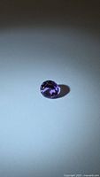 Front view of loose round purple amethyst
