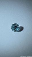 Round brilliant cut blue zircon face-up view
