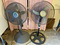 Front view of both pedestal fans side by side