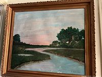 Full view of framed oil painting showing landscape and signature