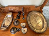 Group view of all trays, candlesticks and loose tops