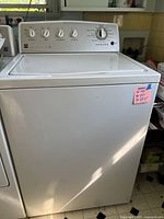 Full frontal view of Kenmore top-load washer showing control panel and dimensions note