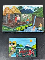 Two folk art paintings together showing full scenes and relative sizes