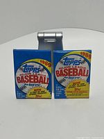 Front view of two sealed 1989 Topps baseball card wax packs