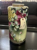 Front view showing hand-painted floral design and gold rim