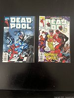 Both Deadpool comic books side by side front covers visible