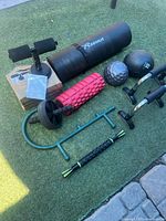 Overall shot of all fitness items laid out on turf
