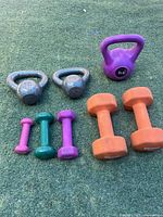 All eight weights arranged on turf