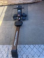 Full view of ProForm rowing machine positioned on mat