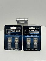 Front view showing two sealed packs of SiriusLED LED 921 CANBUS white bulbs