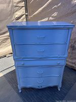 Front view of painted five-drawer French Provincial chest