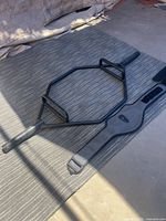 Hex trap bar and weightlifting belt on mat