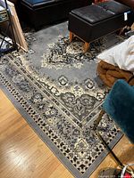 Oblique view of corner and border pattern on rug