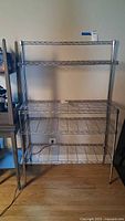 Full view of chrome wire shelving rack, five shelves visible