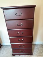 Front view showing six drawers and handles