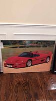 Front view of entire Ferrari F50 board print leaning against wall