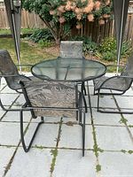 Full patio set showing table and four chairs