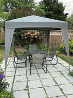 Full view of assembled square gazebo on patio