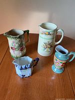 Group shot of four pitchers on table