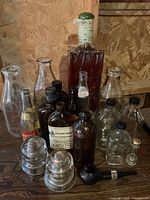 Group view of all bottles, jars, decanter, insulators and pipe