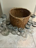 Group shot of all jars, milk bottle and basket