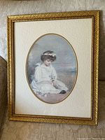 Full view of framed artwork showing frame, mat, and print