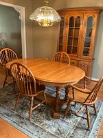 Dining table and four chairs in room