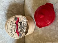 Box lid graphic and red ceramic lid