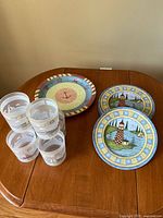 Overall lot showing cups and plates on table