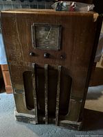 Front view of RCA Victor wooden floor console radio