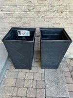 Front view of both black square planters