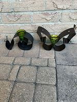 Front view showing both metal holders with green glass cups