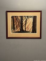 Full view of framed forest artwork on wall